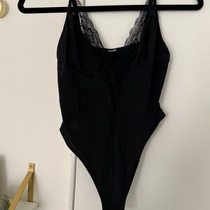 Sheer black lace thong bodysuit